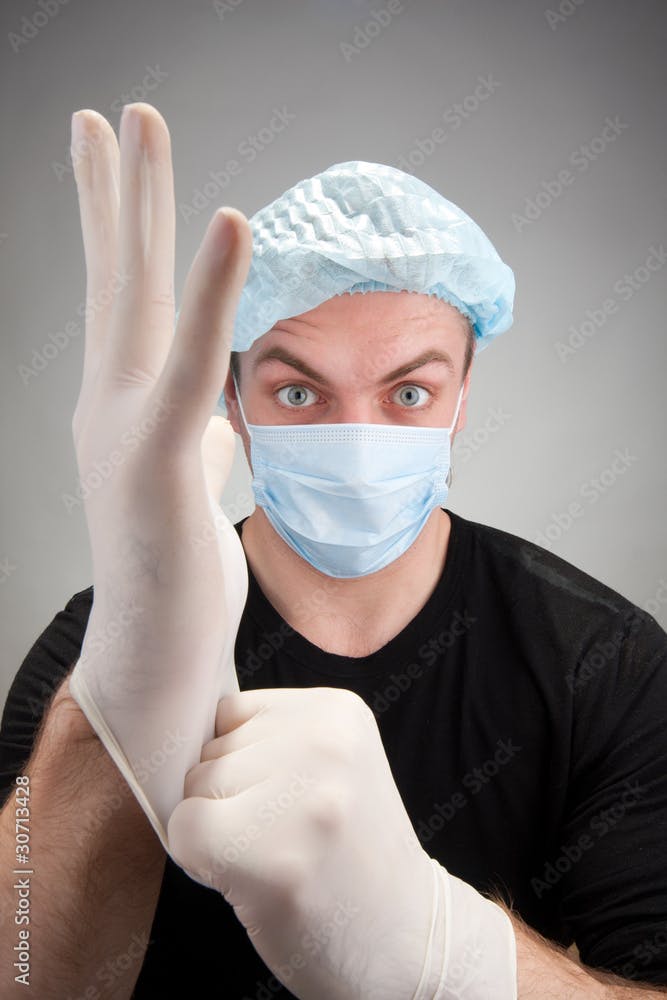 Dark surgeon wearing gloves