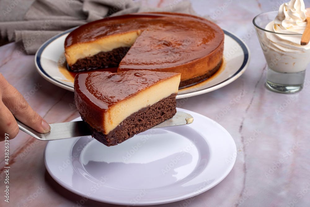 inverted cake chocoflan flan with chocolate sponge cake with cream delicious sweet dessert on counter