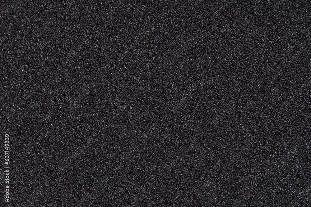 Black soft foam board background. black sponge surface texture.