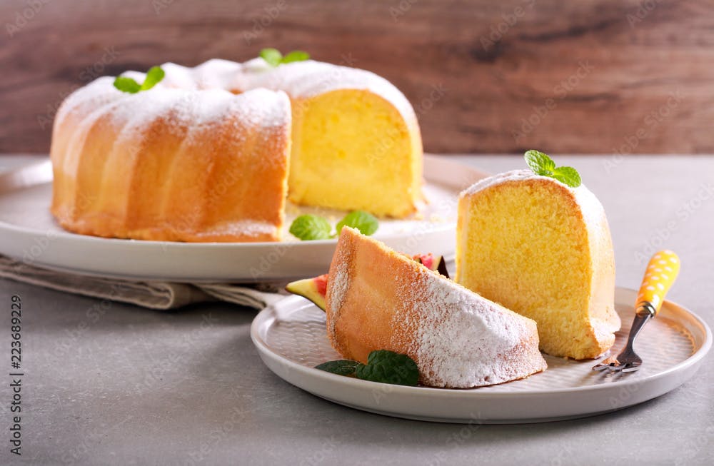 Lemon sponge ring cake with icing sugar
