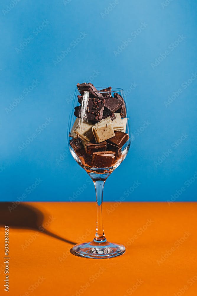 chocolate bar white and black cocoa plate with mermaid and glass of wine