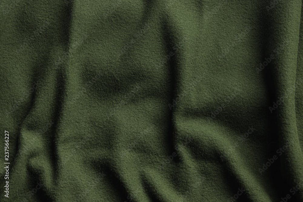 Texture of green fleece, soft insulating fabric