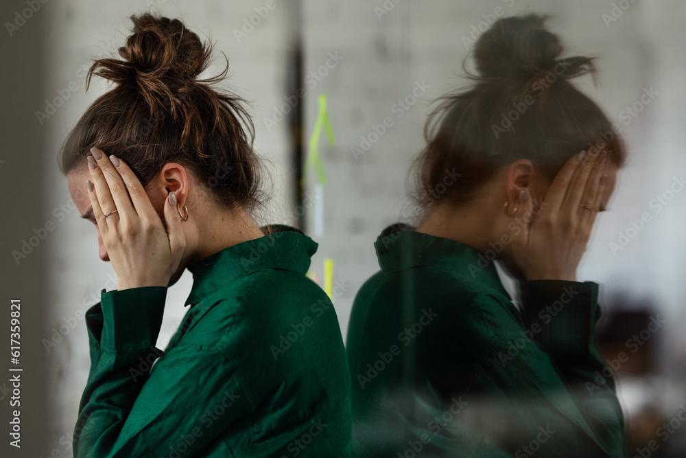 Young sad woman in office, having problem.